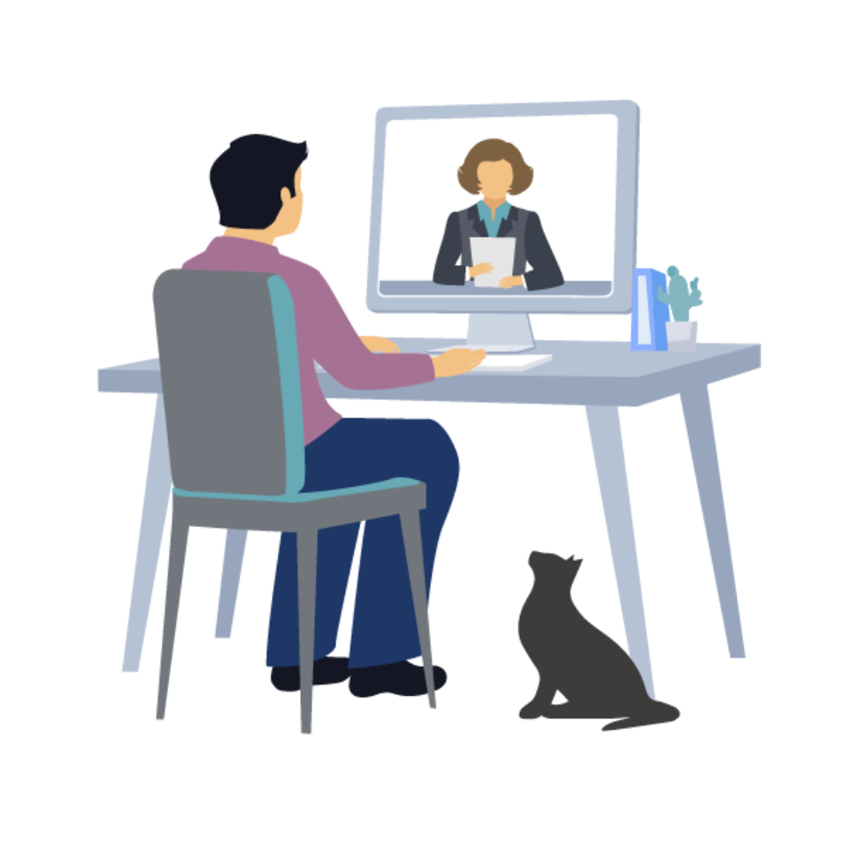 Man sitting at desk with a computer. There is a person on screen and a cat sitting at his feet